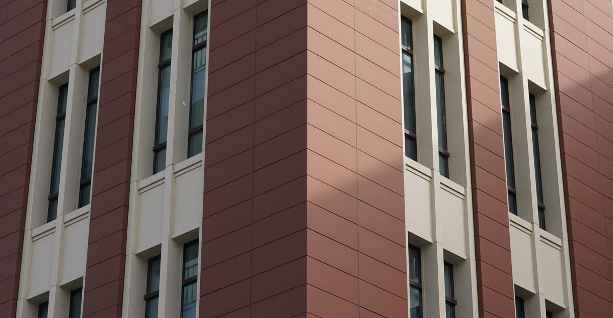 Red terracotta facade of Innovation Harbor.jpg