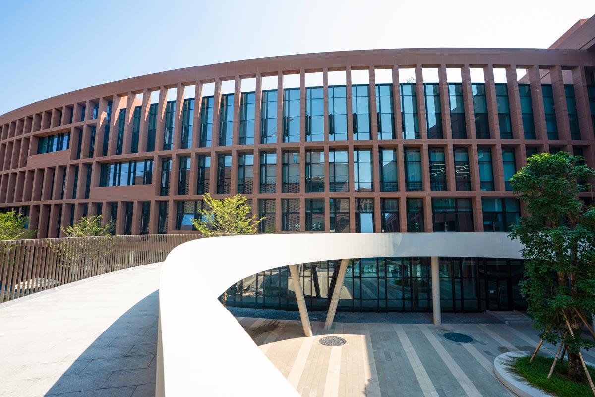 Terracotta in front of glass facade.jpg