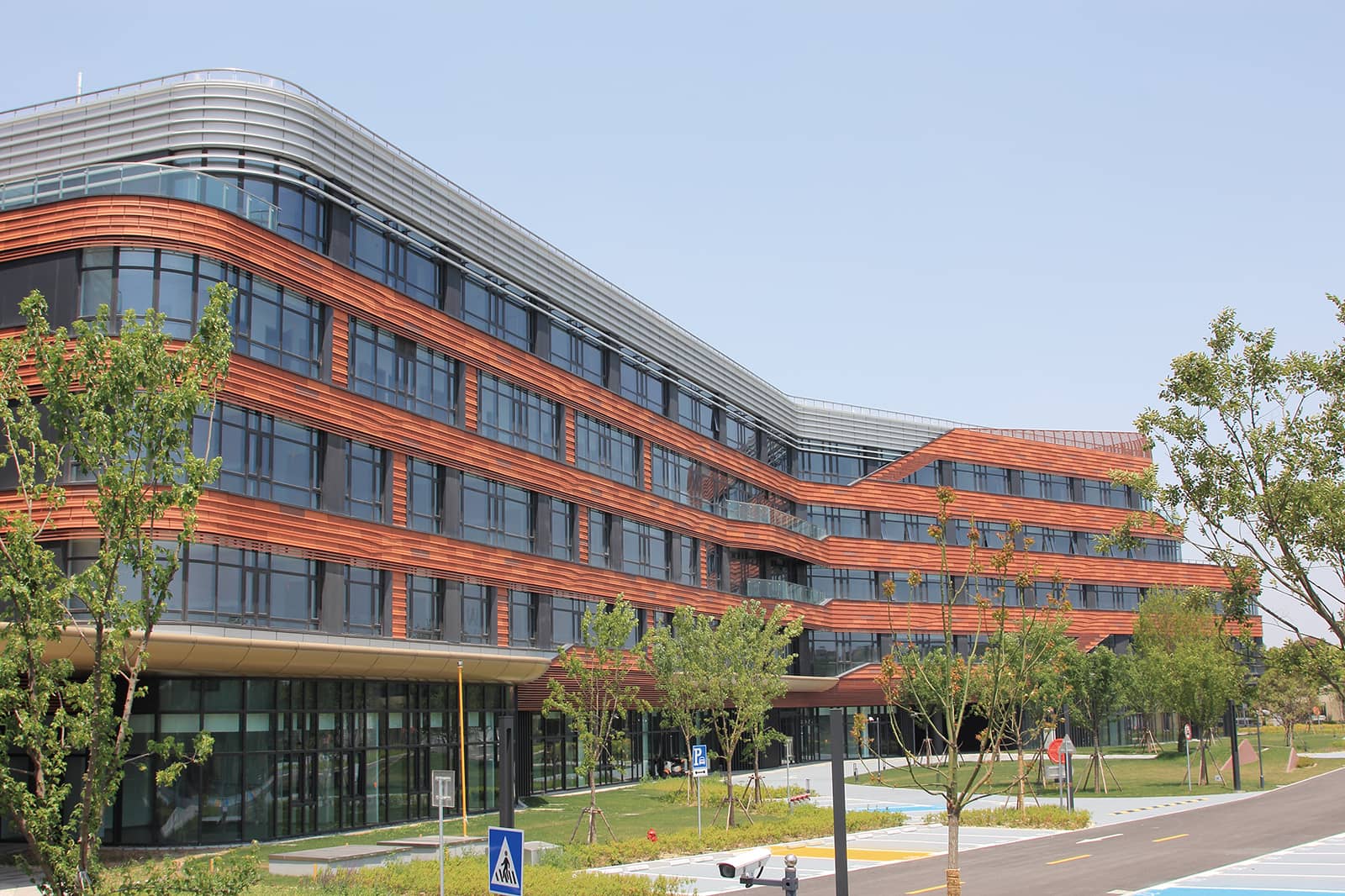 Hospital walls clad in 3 color shades terracotta.jpg