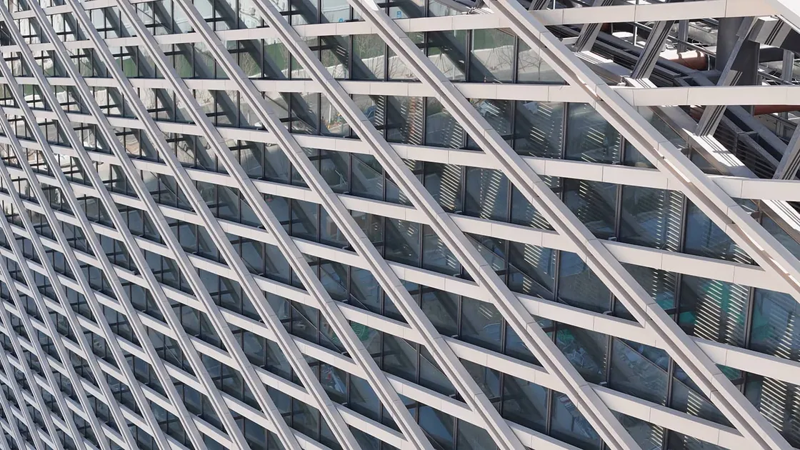 Terracotta batten cladding in front of glass curtain wall.jpg