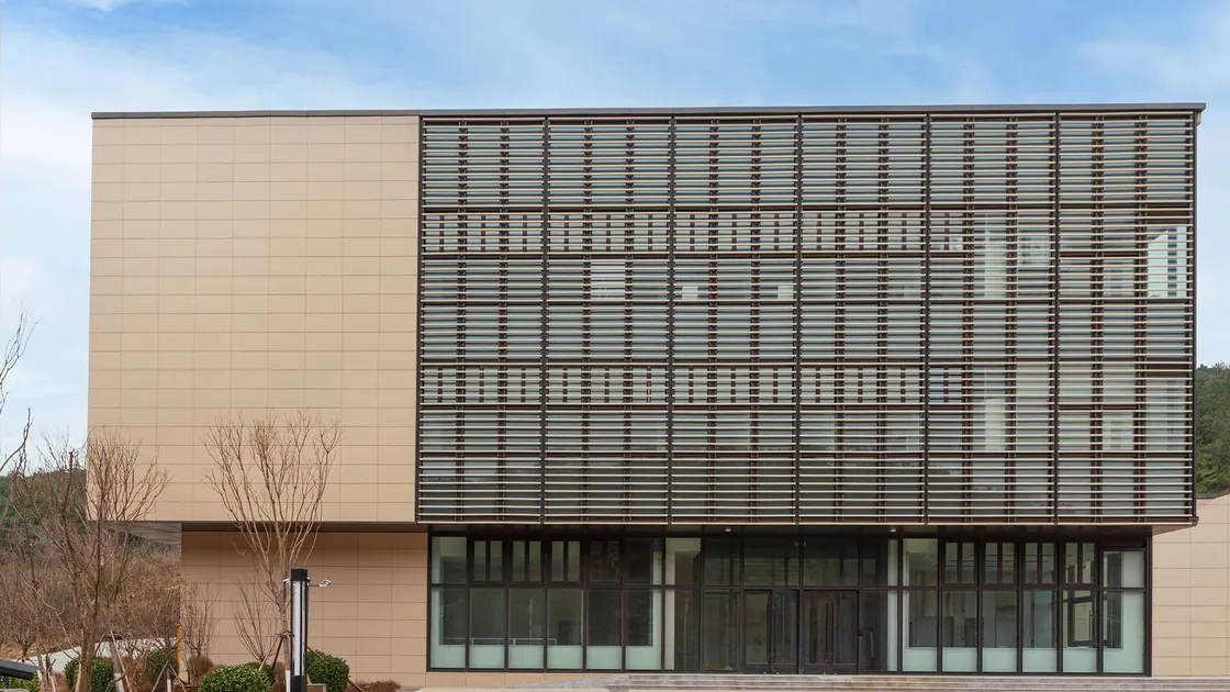 The facade featuring an integrated design of terracotta panels and rods.jpg