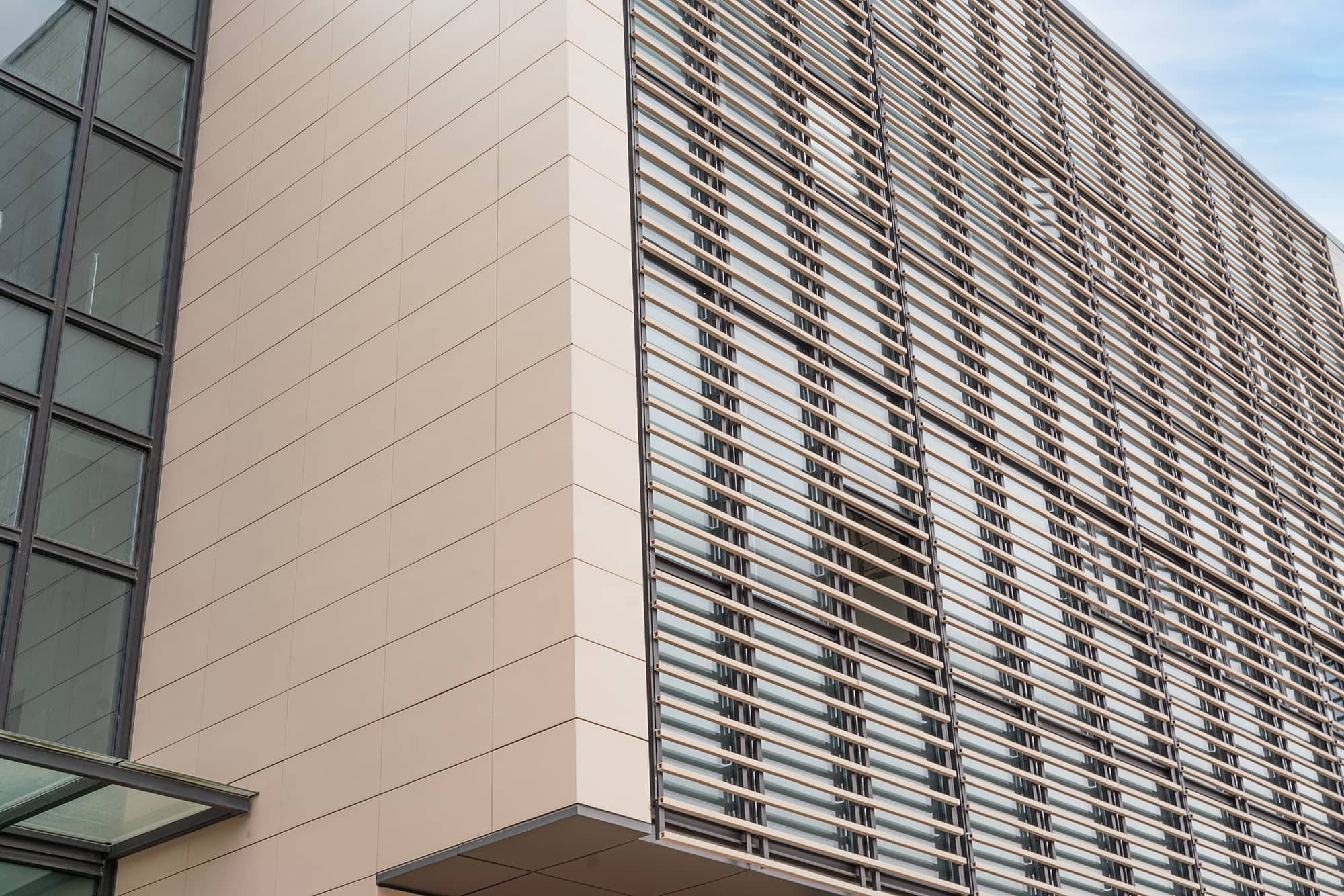 The terracotta Square Baguettes outside the laboratory's glass curtain wall.jpg