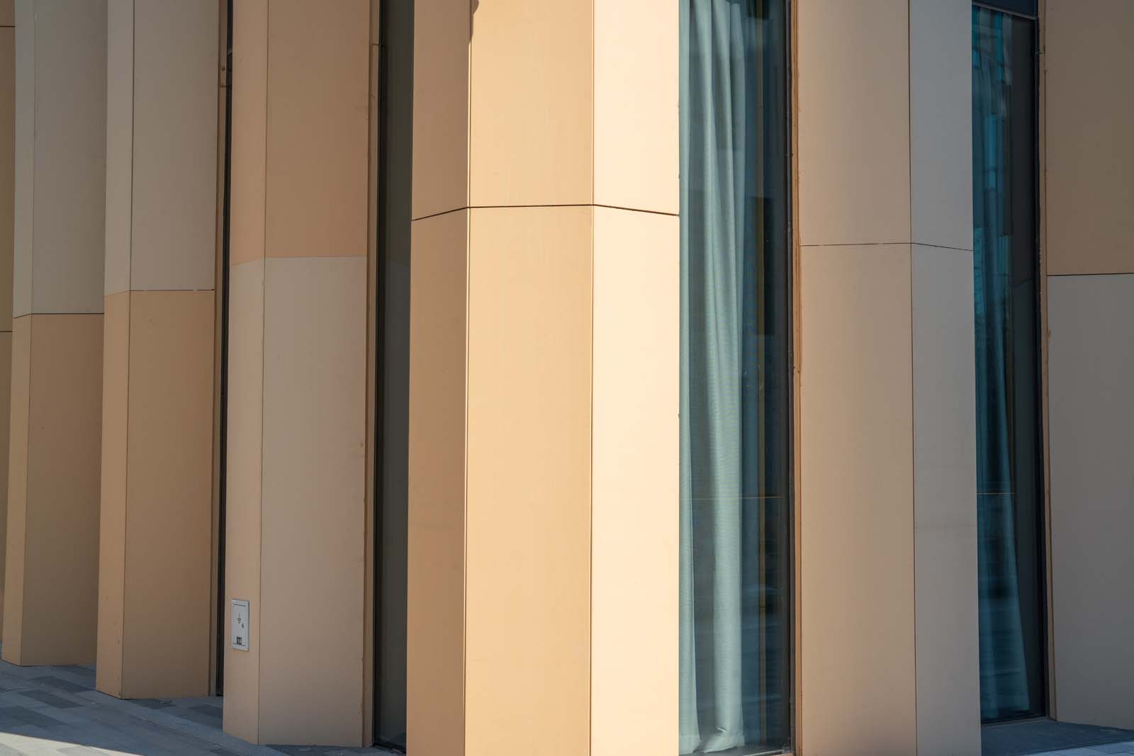 Close-up of LOPO terracotta panels at HaiKai Park showing the overlap edge and textured champagne surface..jpg