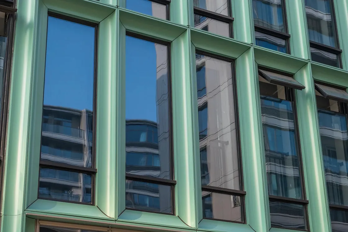 45-degree mitered Haitang corner (Quirk Miter) on a LOPO glazed terracotta panel, wrapping a window reveal with a seamless, sculptural finish.