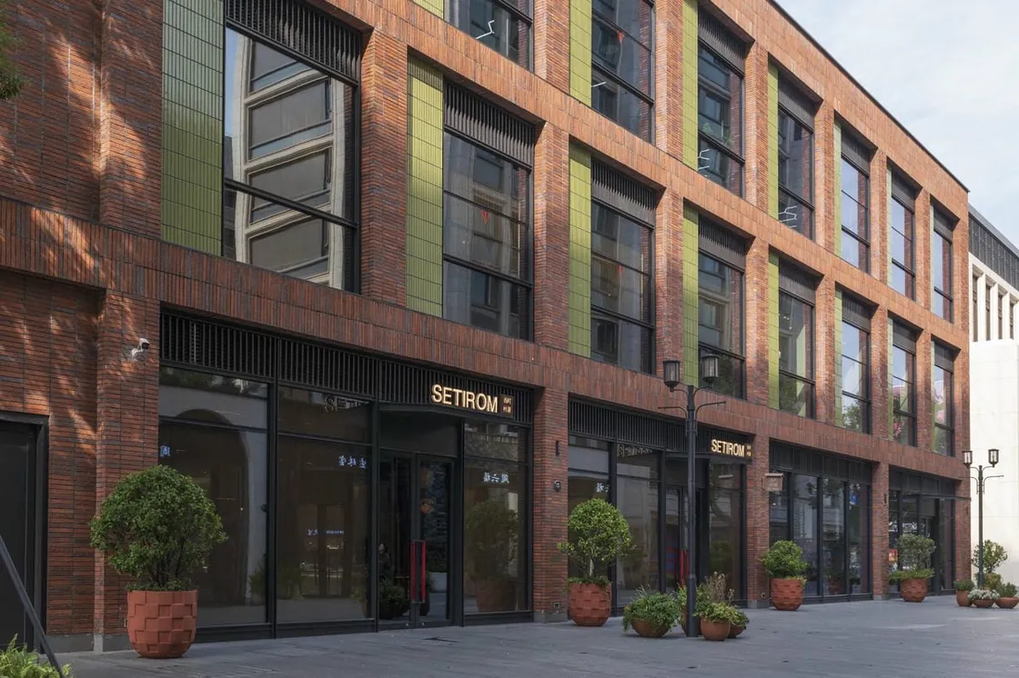 Red clay facing brick retail street facade at Yiwu Place