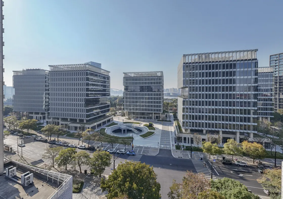 Wide exterior view of Bofeng Center office towers and landscaped grounds in Shanghai.